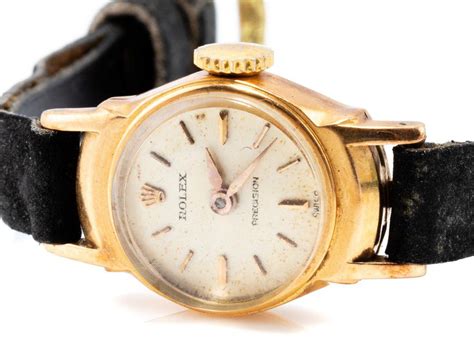 Rolex. An unusual gents 18ct gold wristwatch with a lady's